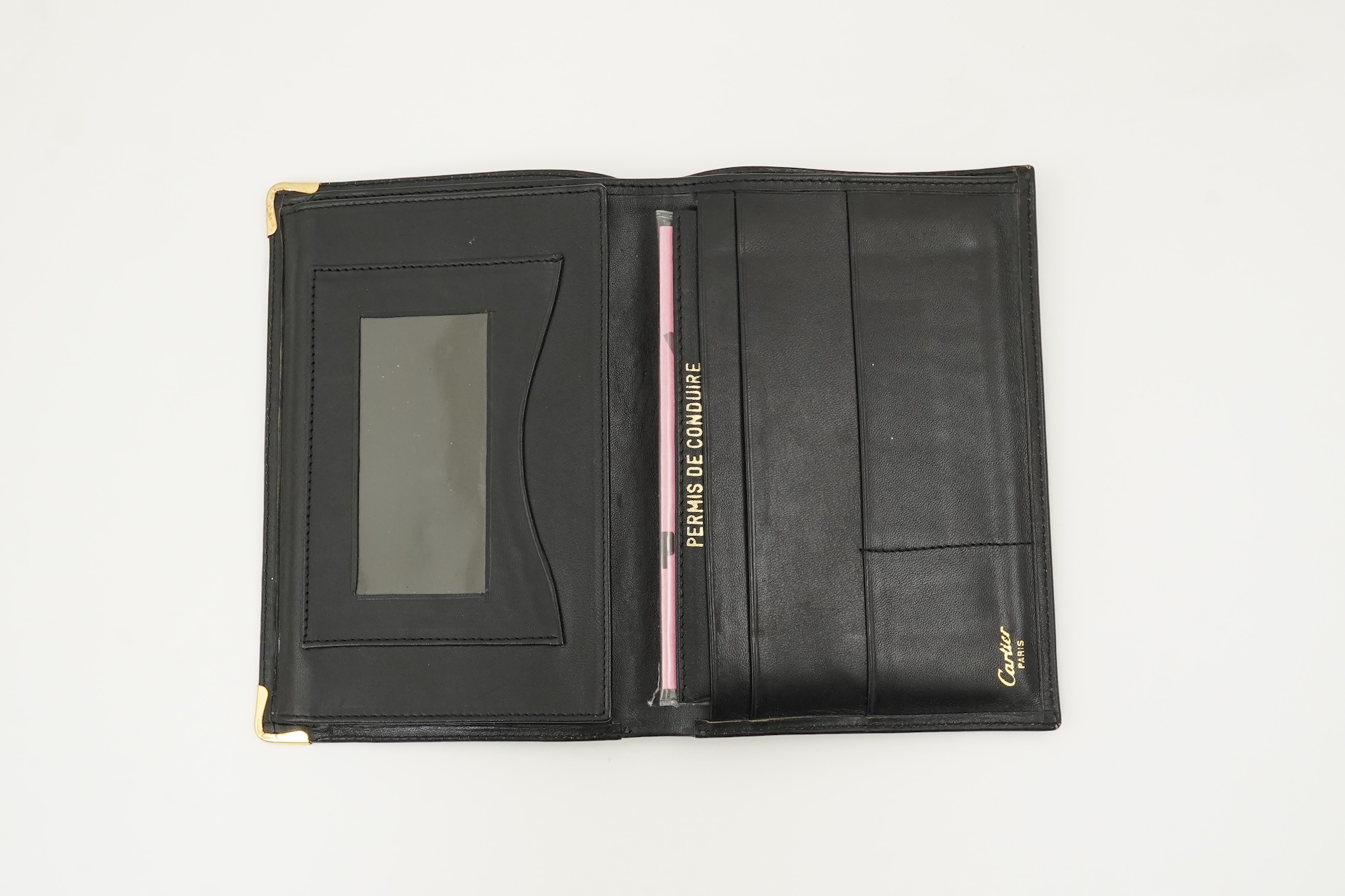 A gentleman's black Cartier wallet